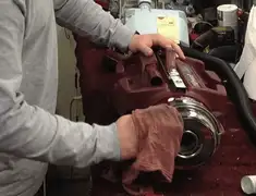 Vacuum repair technician cleaning and servicing a vacuum motor in Jacksonville, FL
